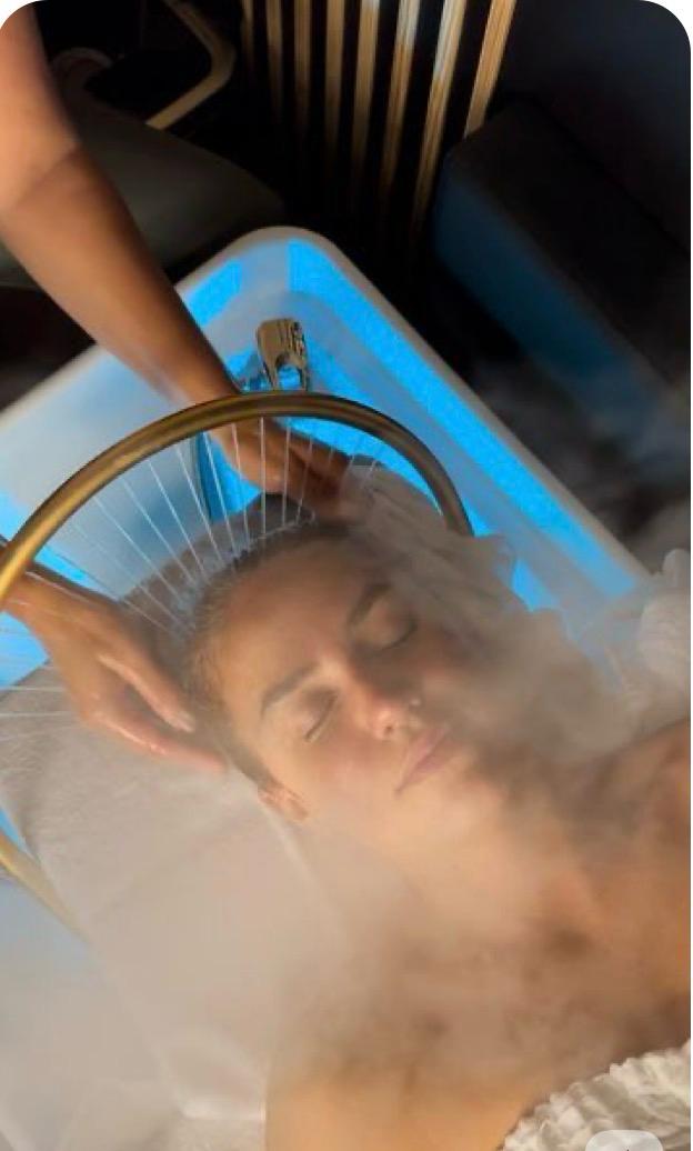 Aromatic steam and gold water arc during the 90 minute head spa ritual